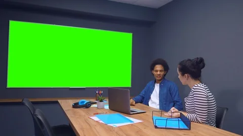 Two workmates teaming up and working together. Stock Footage 111744692