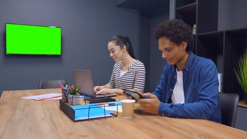 Two workmates teaming up and working together Stock Footage 122362545