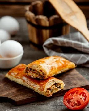 Two wrapped pastry stuffed with herbs Stock Photos