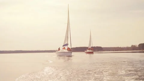Two yachts on the horizon during sunset Stock Footage 110913814