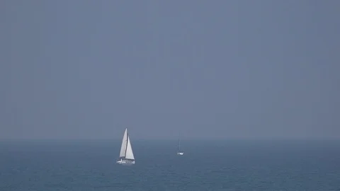 Two yachts (one without sails) in the sea Stock Footage 111032406
