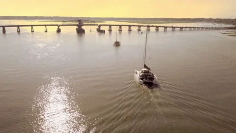 Two yachts pass through swing bridge in Sout Carolina Stock Footage 134483532