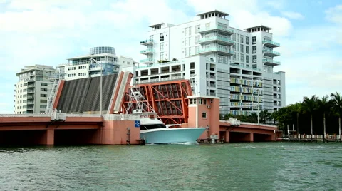 Two yachts passing under bridge Stock Footage 40198896