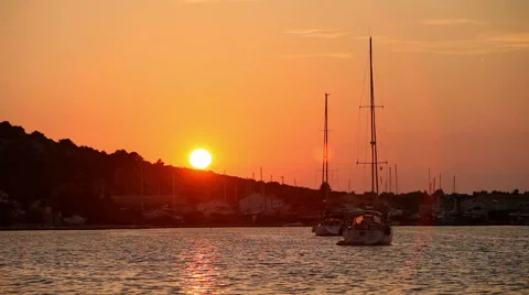 Two yachts in the sea at sunset on a background of mountains Stock Footage 44616815