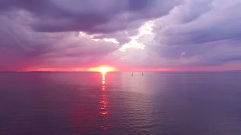Two yachts at sunset on the high seas in a romantic dream trip.Pink sky. Stock Footage 73029519