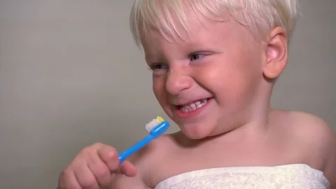 A two-year boy brushing his teeth before going to bed Stock-Footage 83837286