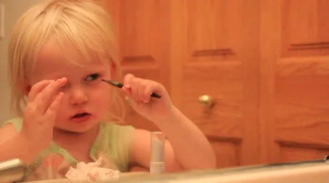 Two year with eyeliner brush Stock Footage 41651706