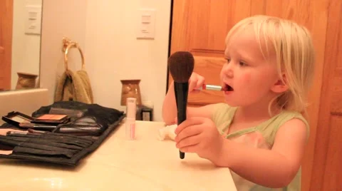 Two year gets her lipstick on Video stock 41651579