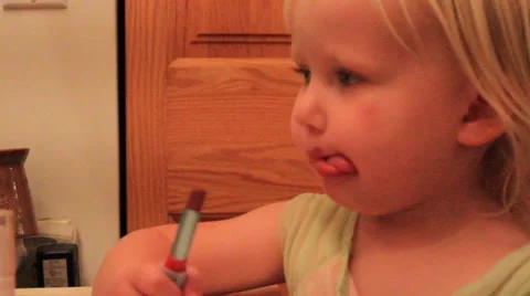 Two year old with bad lipstick Stock Footage 41651447