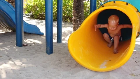  a two-year-old blond boy in a Playground located on the beach. Stock Footage 118365367