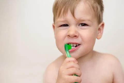 Two year old boy brushing his teeth Stock Photos