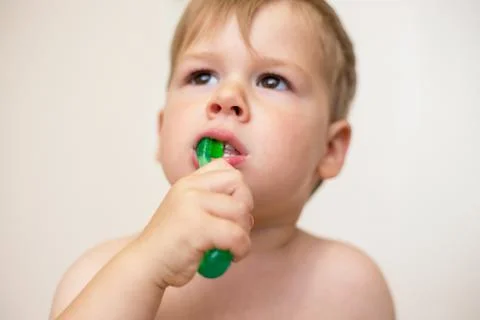 Two year old boy brushing his teeth Stock Photos