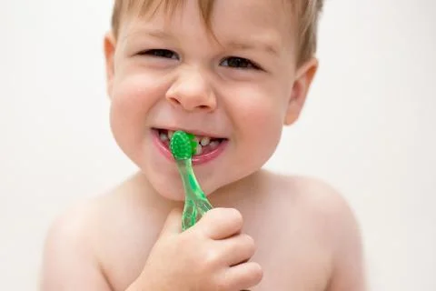 Two year old boy brushing his teeth Stock Photos