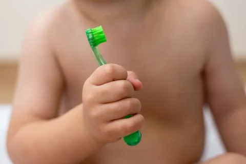 Two year old boy brushing his teeth Stock Photos