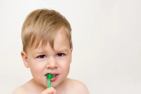 Two year old boy brushing his teeth Stock Photos
