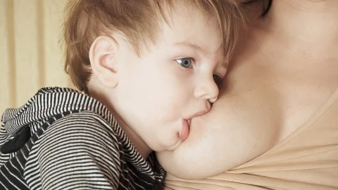 Two-year-old boy eats milk Stock-Footage 126317276