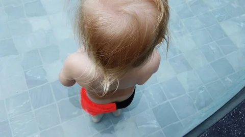 Two year old boy in the pool alone. Stock Footage 104651966