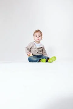 Two-year old boy with a roll Stock Photos