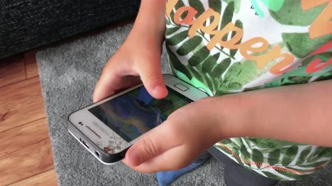 Two-Year-Old Boy Works With a Mobile Phone Vidéo 140389909