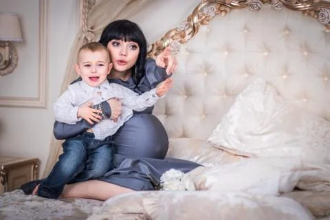 Two year old child cries, Mama hugs him. Stock Photos