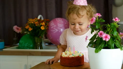A two year old child has a cake. Selective focus. Stock Footage 210127997