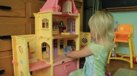 Two year old plays dollhouse Stock Footage 41652063