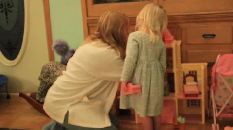 Two year old shows grandma her dollhouse Stock Footage 41742978