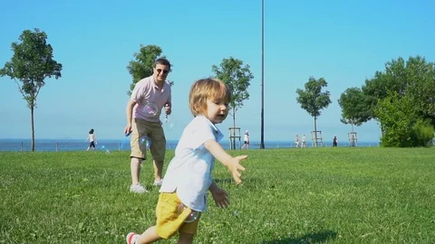 Two year toddler running in park enjoying life with laughs Stock Footage 109218935