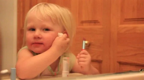 Two year wipes face back and forth Stock Footage 41651543