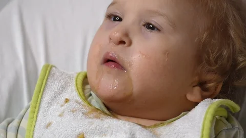 Two years old boy with cerebral palsy is happy after having his meal Video stock 122620663