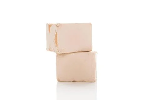 Two yeast cubes for bread making isolated on white background. Yeast cubes... Foto stock