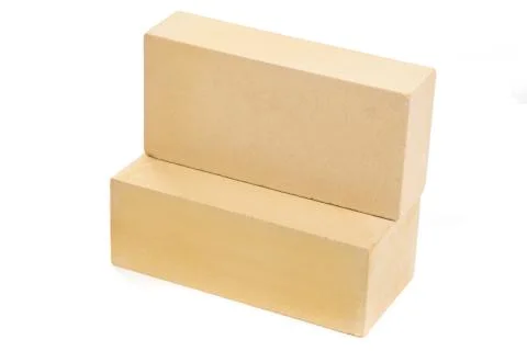 Two yellow ceramic bricks at the white background, isolated Foto stock