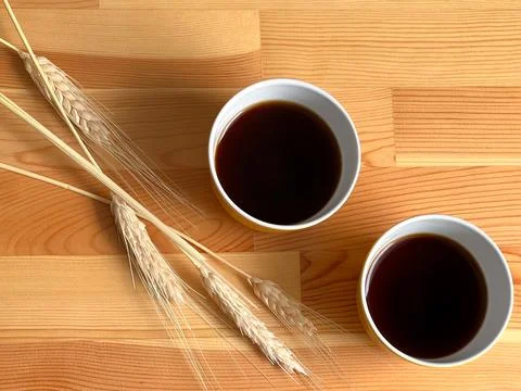 Two yellow coffee cups on the table Stock Photos