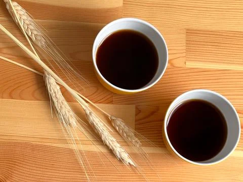 Two yellow coffee cups on the table Stock Photos