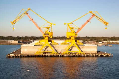 Two yellow cranes Stock Photos
