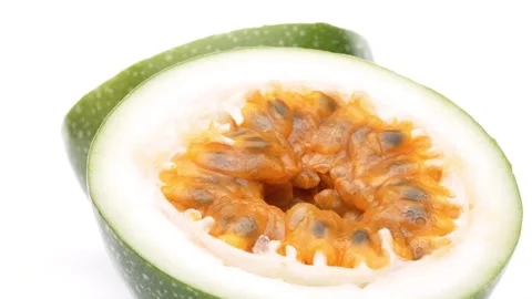 Two yellow passion fruit halves rotating on white background. Stock Footage 159155581
