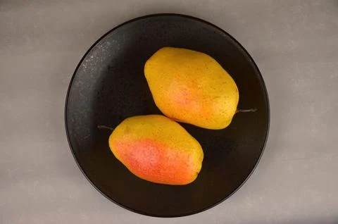 Two yellow pears Stock Photos