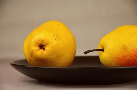 Two yellow pears Stock Photos