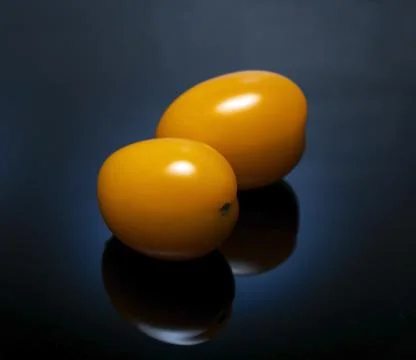 Two yellow tomatoes Stock-Fotos