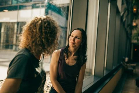 Two yoga trainers having a chat Stock Photos