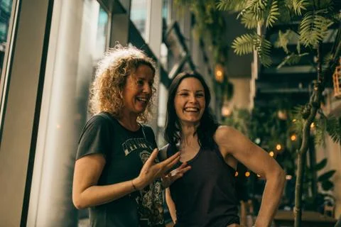 Two yoga trainers having a chat Stock Photos