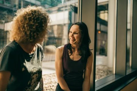 Two yoga trainers having a chat Stock Photos