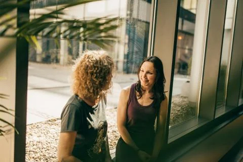 Two yoga trainers having a chat Stock Photos