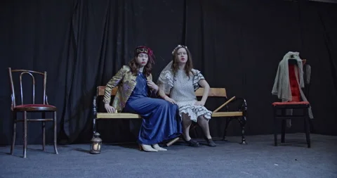Two Young Actresses Rehearse a Scene on Stage, One Consoling the Other While Stock Footage 312077769
