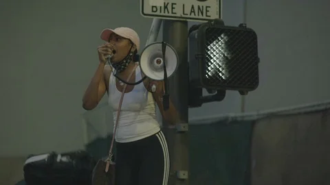 Two young adults shouting on a protest, BLM, Downtown, LA, June 3 2020 Stock Footage 136749702