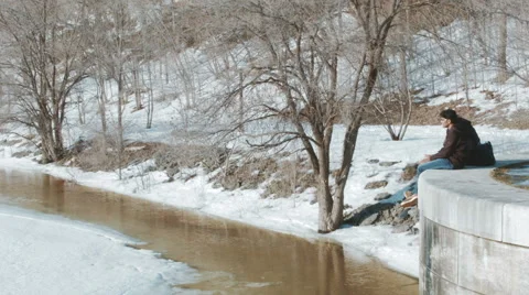 Two young adults talk each other above Rideau Lake in Ottawa, Ontario/Canada Stock Footage 65404617