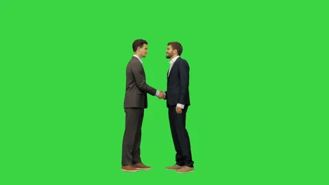 Two young and handsome business partners in suits meet and shake hands, full Vídeo Stock 150541925