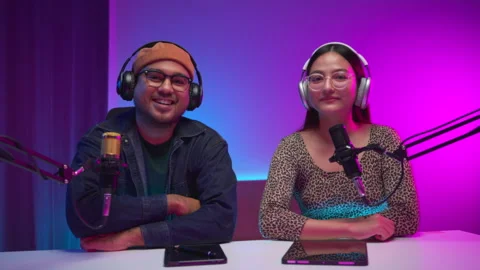 Two young asian streamer host making live podcast at broadcast home studio.  Stock Footage 289542454