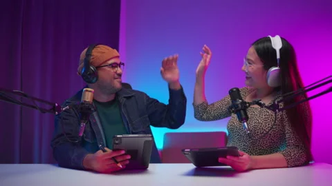 Two young asian streamer host making live podcast with condenser microphone and Video stock 289542731