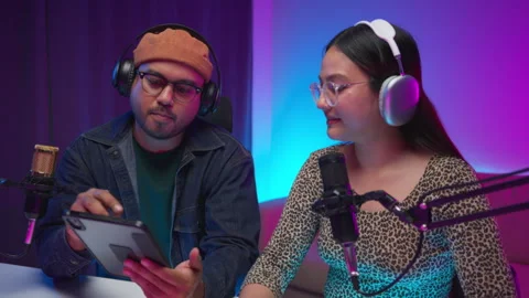 Two young asian streamer host making live podcast at broadcast home studio.  스톡 동영상 289542750